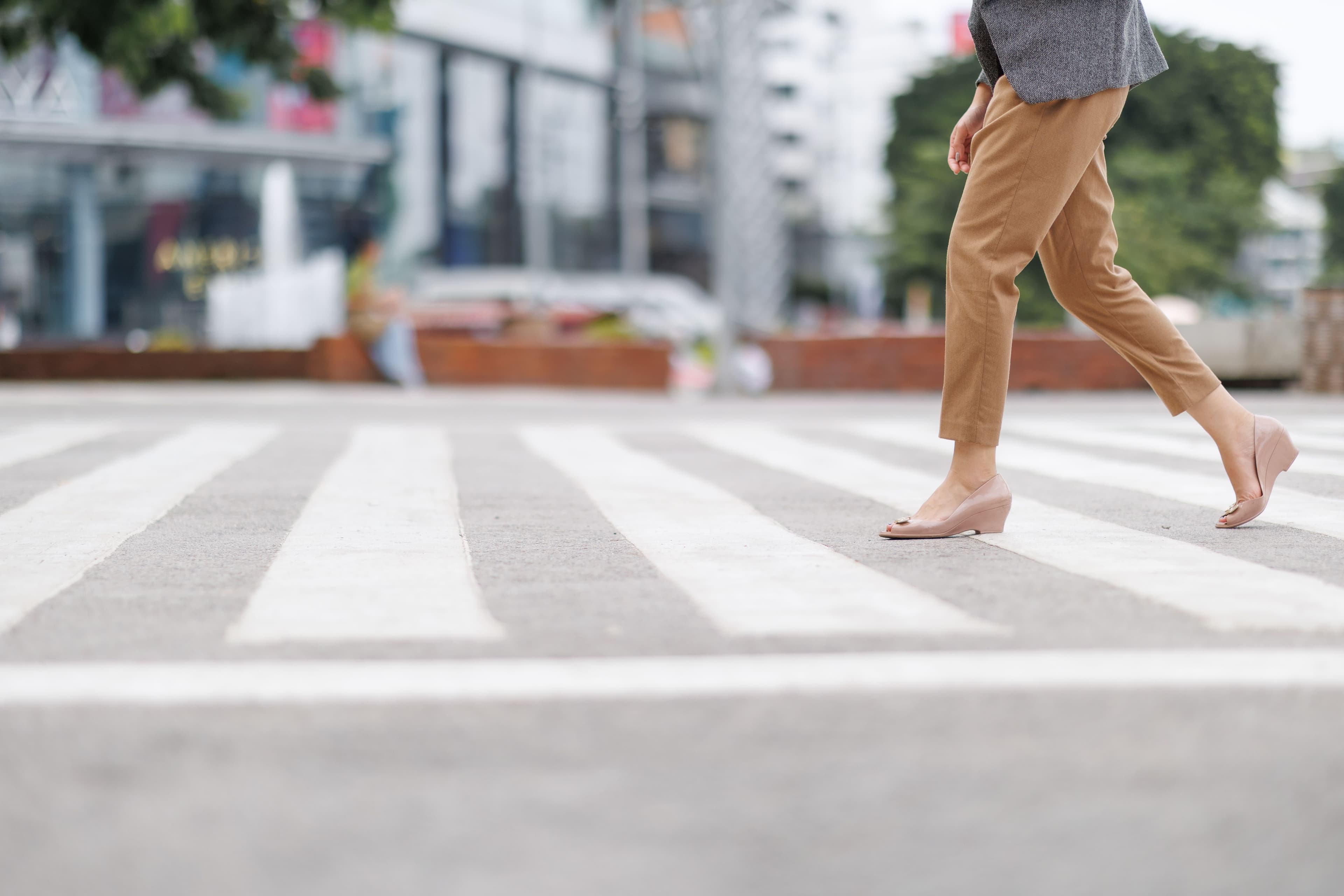A pedestrian walking across the street lawfully under Florida crosswalk laws.